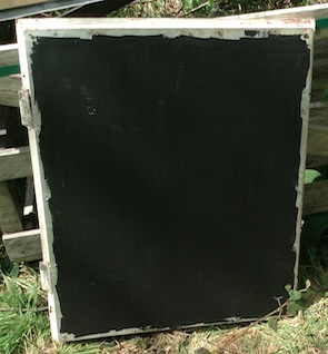 underside of solar collector with black paint